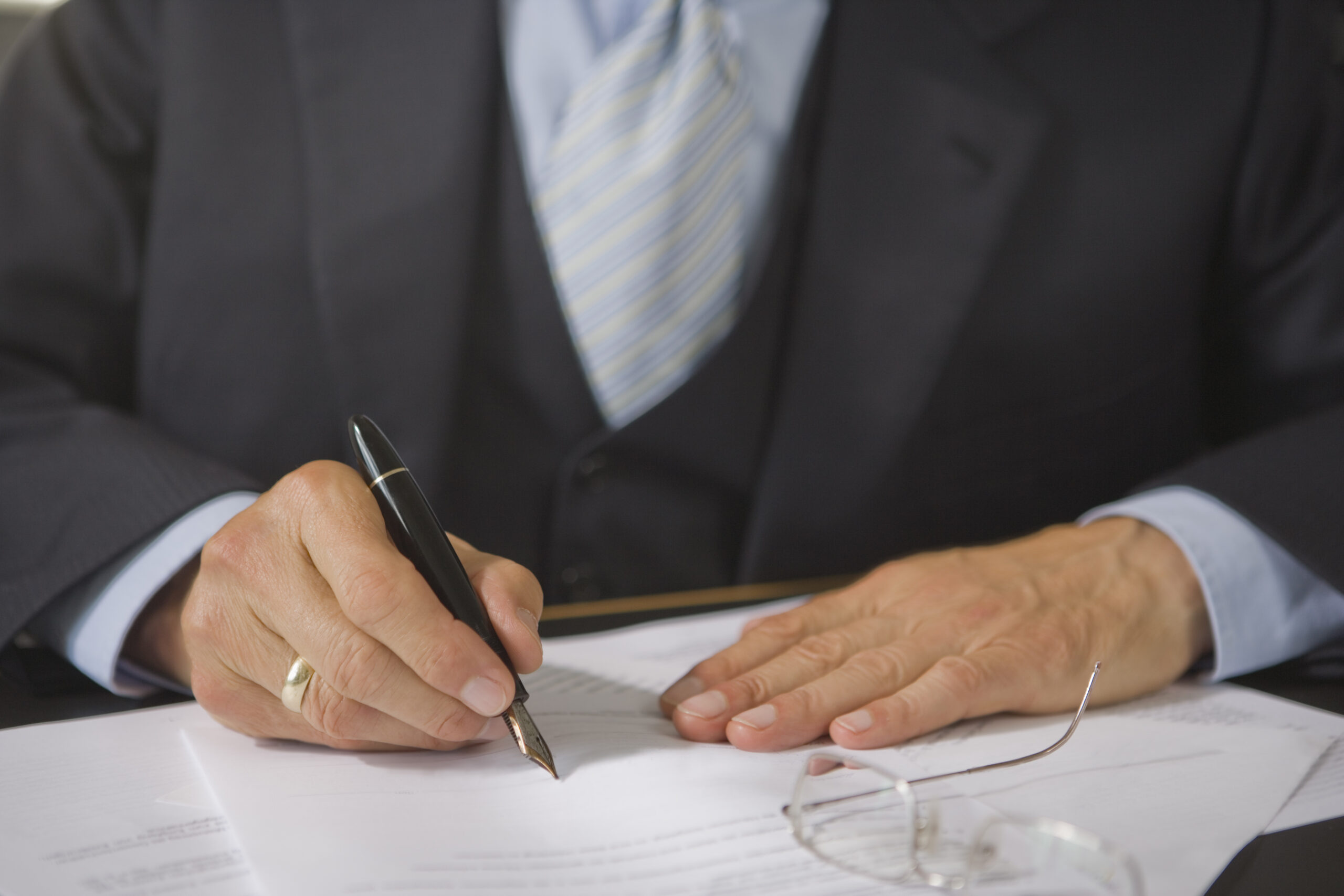 mid section view of a lawyer filling a form 2026 03 26 03 41 14 utc