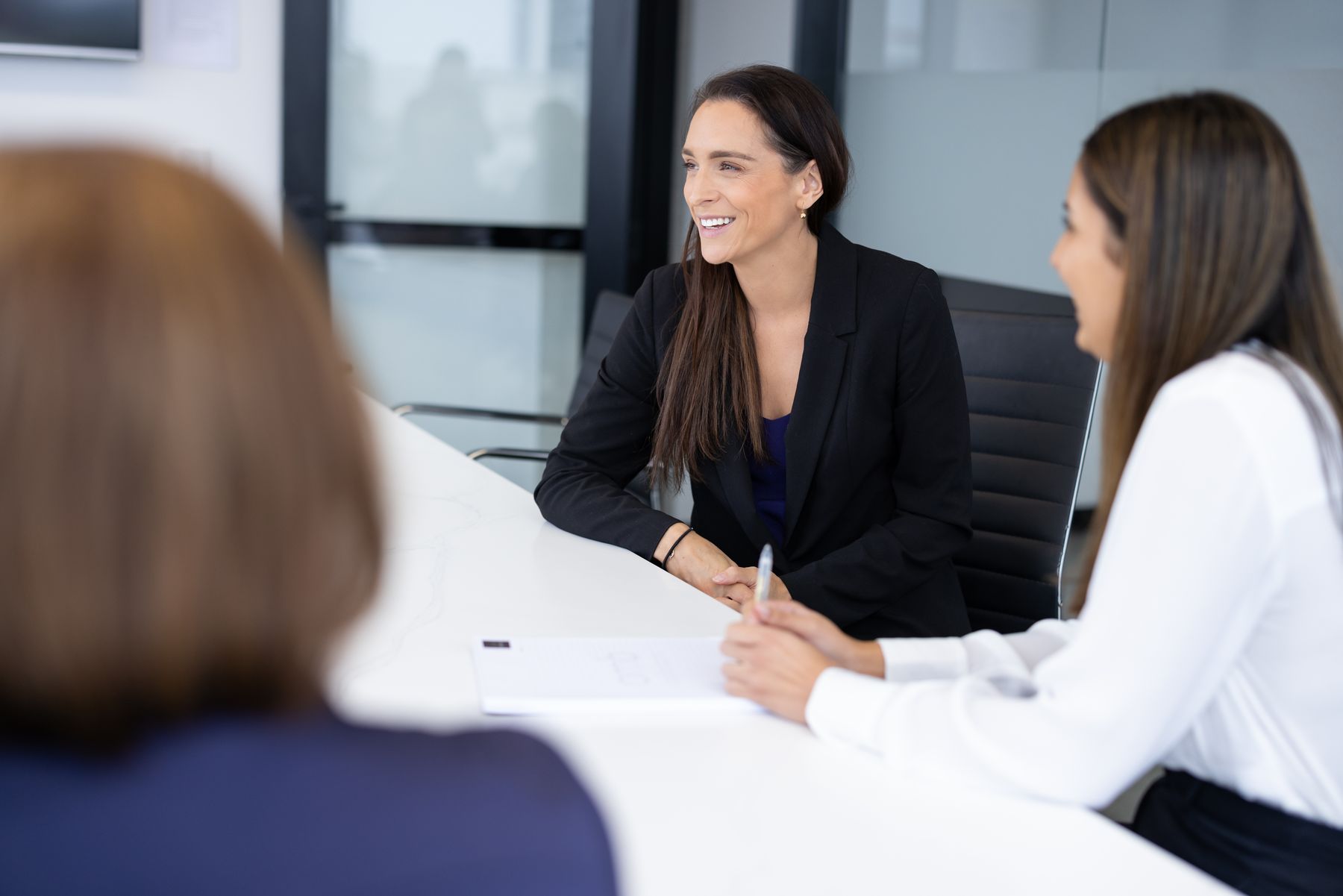 Two OMB lawyers going through a contract with a client
