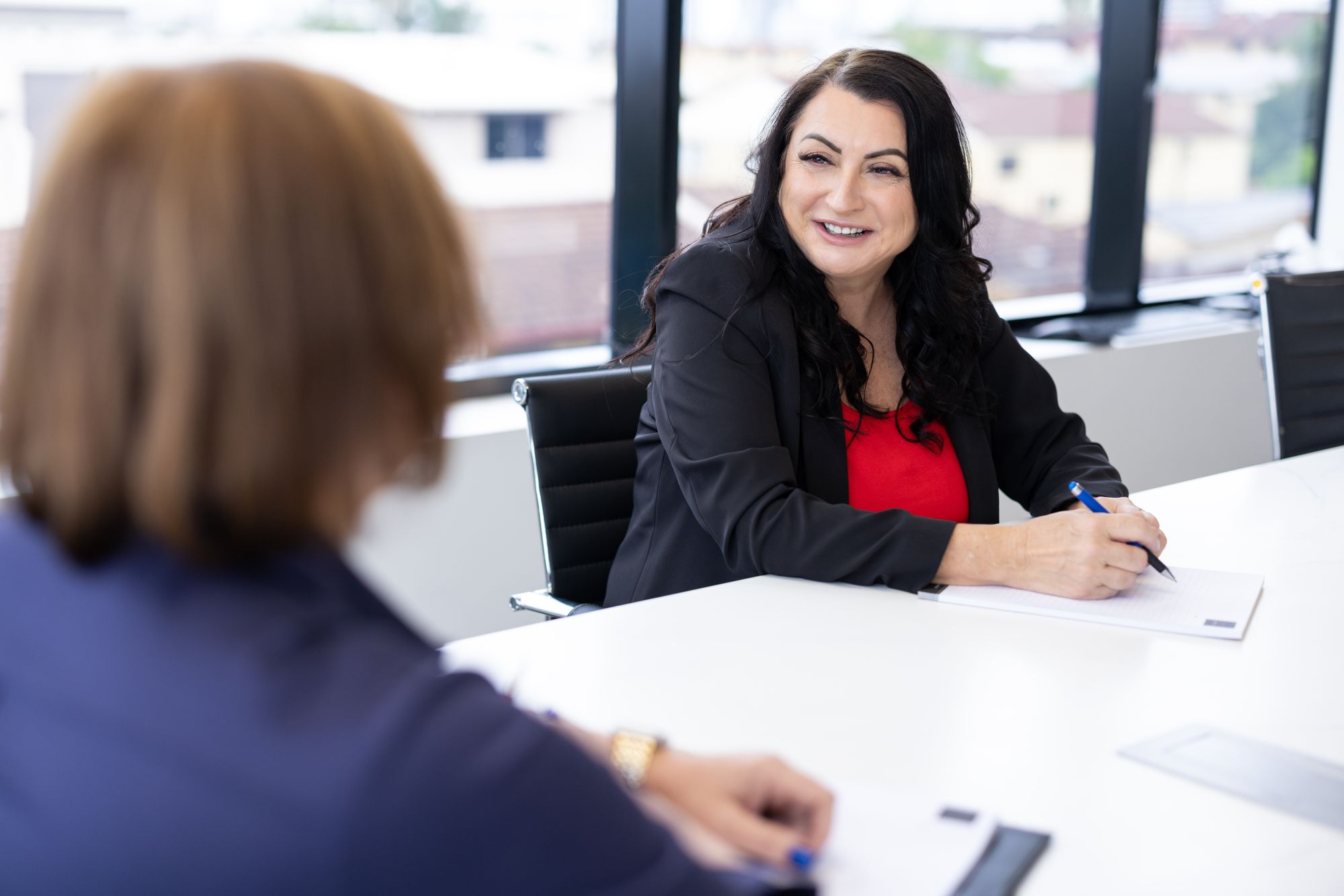 A client meeting in OMB's boardroom